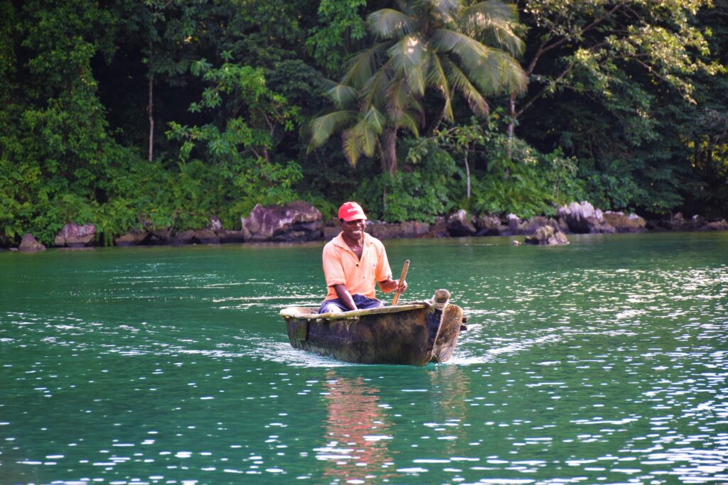 Fisherman in a traditional canoe in São Tomé and Príncipe